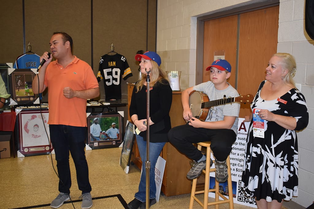 Phoenixville Mayor Peter Urscheler makes announcements before the Spaghetti Dinner raffle